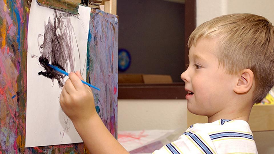 Young boy painting
